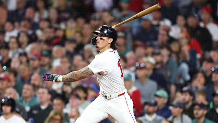 Aug 18, 2025; Boston, Massachusetts, USA; Boston Red Sox left fielder Jarren Duran (16) hits an RBI sacrifice fly during the seventh inning against the Baltimore Orioles at Fenway Park. Mandatory Credit: Paul Rutherford-Imagn Images