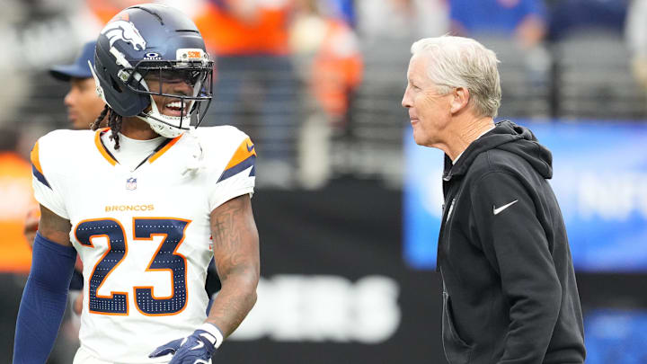 Dec 7, 2025; Paradise, Nevada, USA; Denver Broncos cornerback Jahdae Barron (23) and Las Vegas Raiders head coach Pete Carroll interact prior to a game at Allegiant Stadium. Mandatory Credit: Stephen R. Sylvanie-Imagn Images Dec 7, 2025; Paradise, Nevada, USA; Denver Broncos cornerback Jahdae Barron (23) and Las Vegas Raiders head coach Pete Carroll interact prior to a game at Allegiant Stadium. Mandatory Credit: Stephen R. Sylvanie-Imagn Images