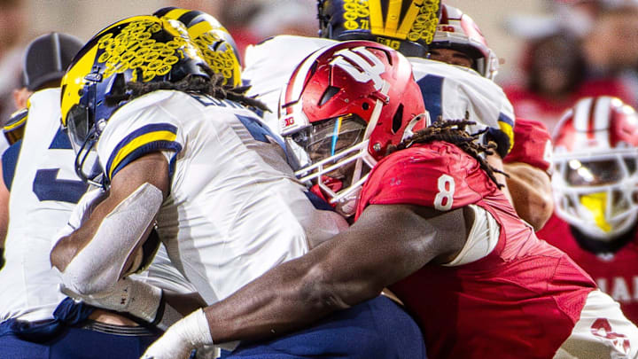 Indiana defensive tackle CJ West tackles (8) Michigan's Donovan Edwards at Memorial Stadium 