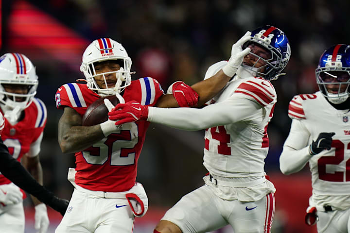 Dec 1, 2025; Foxborough, Massachusetts, USA; New England Patriots running back TreVeyon Henderson (32) runs the ball against Dec 1, 2025; Foxborough, Massachusetts, USA; New England Patriots running back TreVeyon Henderson (32) runs the ball against