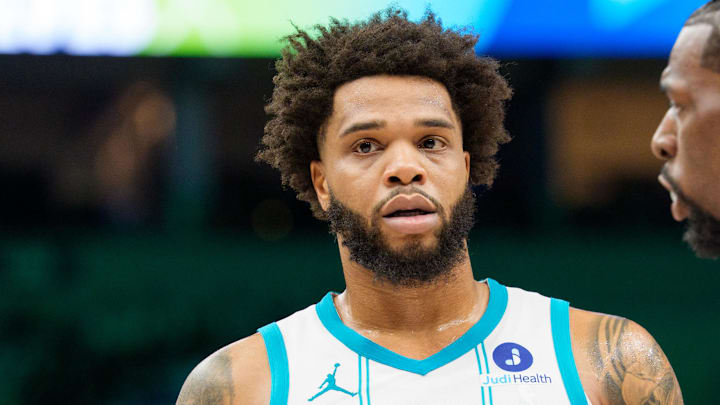 Apr 5, 2026; Minneapolis, Minnesota, USA; Charlotte Hornets forward Miles Bridges (0) and Minnesota Timberwolves center Naz Reid (11) during a break in the second quarter at Target Center. Mandatory Credit: Matt Blewett-Imagn Images
