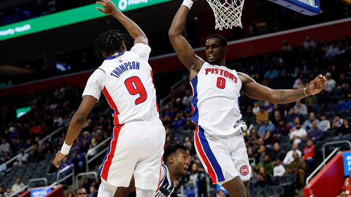 Jan 31, 2025; Detroit, Michigan, USA; Dallas Mavericks forward Olivier-Maxence Prosper (8) is defended by Detroit Pistons forward Ausar Thompson (9) and center Jalen Duren (0) in the first half at Little Caesars Arena. Mandatory Credit: Rick Osentoski-Imagn Images Jan 31, 2025; Detroit, Michigan, USA; Dallas Mavericks forward Olivier-Maxence Prosper (8) is defended by Detroit Pistons forward Ausar Thompson (9) and center Jalen Duren (0) in the first half at Little Caesars Arena. Mandatory Credit: Rick Osentoski-Imagn Images