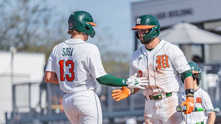 Miami Hurricanes catcher Alex Sosa (13) and right fielder Derek Williams (2) against Lafayette Miami Hurricanes catcher Alex Sosa (13) and right fielder Derek Williams (2) against Lafayette