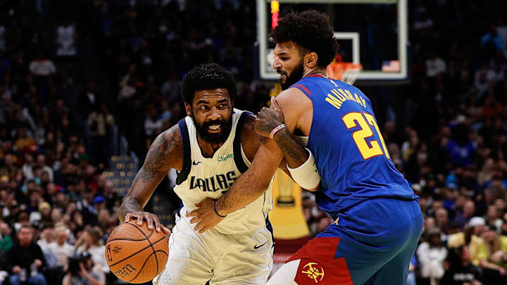 Nov 22, 2024; Denver, Colorado, USA; Dallas Mavericks guard Kyrie Irving (11) drives to the basket against Denver Nuggets guard Jamal Murray (27) in the third quarter at Ball Arena. Mandatory Credit: Isaiah J. Downing-Imagn Images