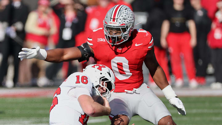 Ohio State Buckeyes linebacker Sonny Styles tackles Rutgers Scarlet Knights quarterback Athan Kaliakmanis Ohio State Buckeyes linebacker Sonny Styles tackles Rutgers Scarlet Knights quarterback Athan Kaliakmanis