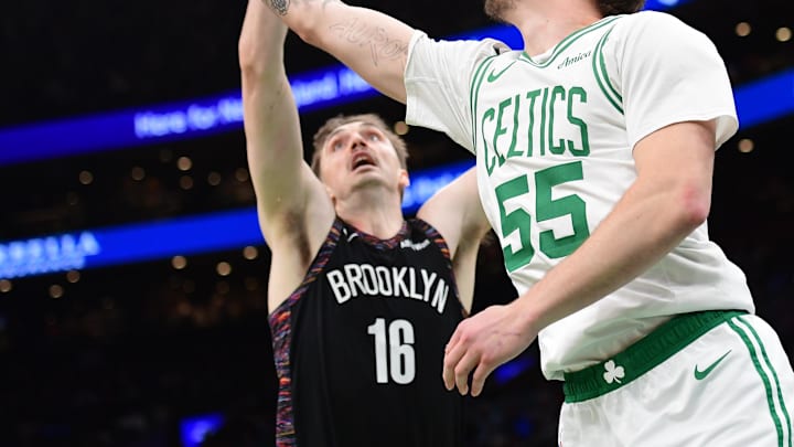 Feb 27, 2026; Boston, Massachusetts, USA; Boston Celtics guard Baylor Scheierman (55) underhands the ball while Brooklyn Nets guard Grant Nelson (16) during the second half at TD Garden. Mandatory Credit: Bob DeChiara-Imagn Images