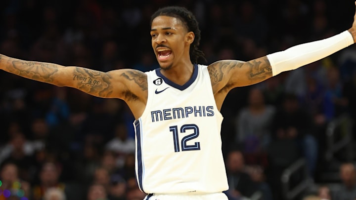 Dec 23, 2022; Phoenix, Arizona, USA; Memphis Grizzlies guard Ja Morant (12) celebrates a shot against the Phoenix Suns in the second half at Footprint Center. Mandatory Credit: Mark J. Rebilas-Imagn Images