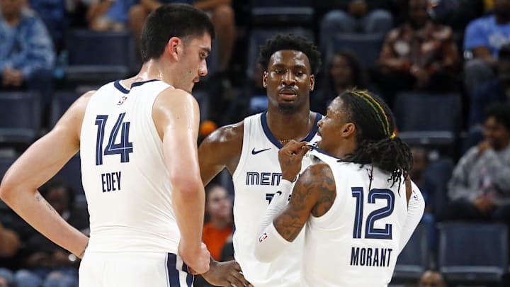 Oct 30, 2024; Memphis, Tennessee, USA; Memphis Grizzlies guard Ja Morant (12) talks with center Zach Edey (14) and forward Jaren Jackson Jr. (13) during the first half against the Brooklyn Nets at FedExForum. Mandatory Credit: Petre Thomas-Imagn Images Oct 30, 2024; Memphis, Tennessee, USA; Memphis Grizzlies guard Ja Morant (12) talks with center Zach Edey (14) and forward Jaren Jackson Jr. (13) during the first half against the Brooklyn Nets at FedExForum. Mandatory Credit: Petre Thomas-Imagn Images