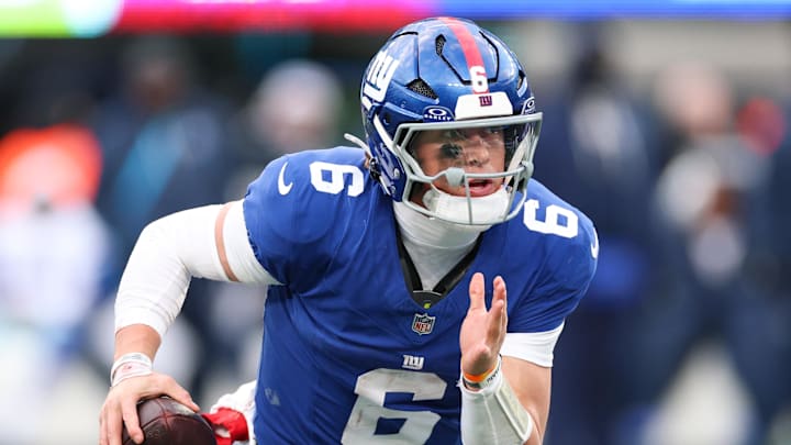 Jan 4, 2026; East Rutherford, New Jersey, USA; New York Giants quarterback Jaxson Dart (6) scrambles during the fourth quarter against the Dallas Cowboys at MetLife Stadium.  