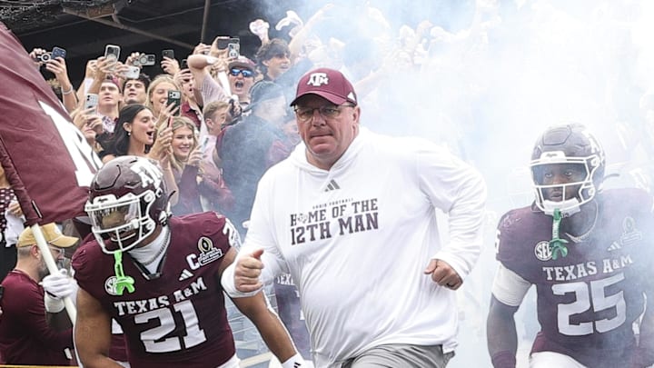 Texas A&M Aggies head coach Mike Elko takes the field prior to the game against the Miami Hurricanes during the first round of the CFP National Playoff at Kyle Field.