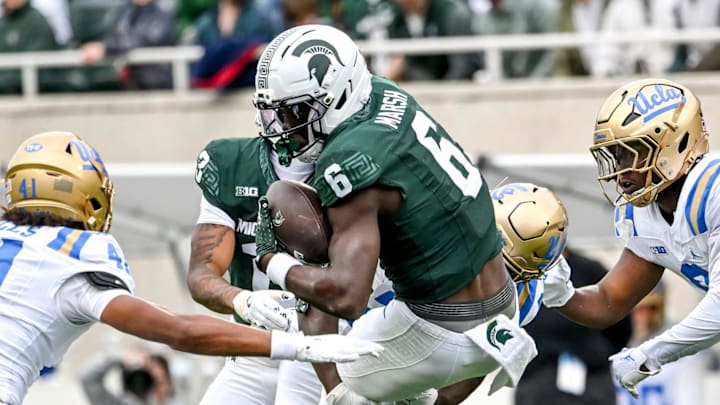 Michigan State's Nick Marsh runs for a gain against UCLA during the first quarter on Saturday, Oct. 11, 2025, at Spartan Stadium in East Lansing. Michigan State's Nick Marsh runs for a gain against UCLA during the first quarter on Saturday, Oct. 11, 2025, at Spartan Stadium in East Lansing.