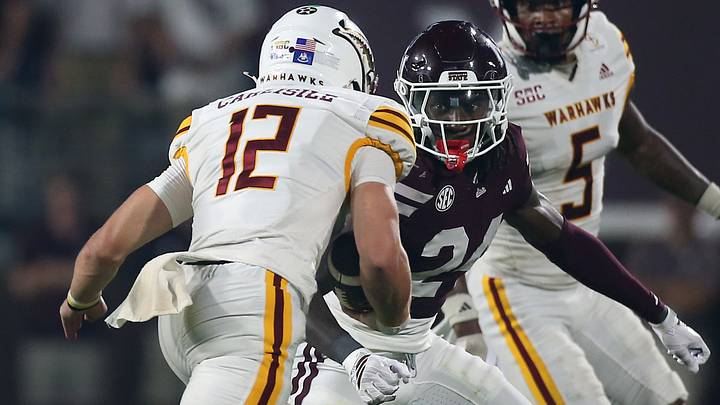 Mississippi State Bulldogs cornerback Quentin Taylor (24) attempts to tackle Louisiana Monroe Warhawks quarterback Austin Carlisle (12) during the fourth quarter at Davis Wade Stadium at Scott Field. Mississippi State Bulldogs cornerback Quentin Taylor (24) attempts to tackle Louisiana Monroe Warhawks quarterback Austin Carlisle (12) during the fourth quarter at Davis Wade Stadium at Scott Field.