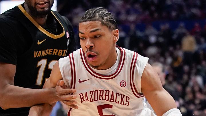 Arkansas guard Darius Acuff Jr. (5) gets past Vanderbilt forward Jalen Washington (13) during the second half of the SEC tournament championship game at Bridgestone Arena in Nashville, Tenn., Sunday, March 15, 2026.