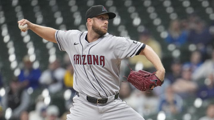 Apr 28, 2026; Milwaukee, Wisconsin, USA; Arizona Diamondbacks pitcher Merrill Kelly (29) delivers  a pitch against the Milwaukee Brewers in the first inning at American Family Field. Mandatory Credit: Michael McLoone-Imagn Images