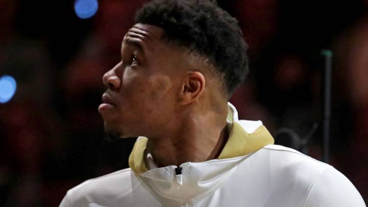Milwaukee Bucks forward Giannis Antetokounmpo (34) watches as the Milwaukee Bucks' 2021 championship banner is unveiled with his Championship ring during the Milwaukee Bucks ring ceremony on  Oct. 19, 2021.