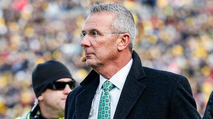 Nov 25, 2023; Ann Arbor, MI, USA;  Ohio State Buckeyes former head coach Urban Meyer walks by the end zone during the first half between Michigan and Ohio State at Michigan Stadium in Ann Arbor on Saturday, Nov. 25, 2023. Mandatory Credit: Junfu Han-Imagn Images