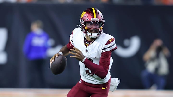Sep 23, 2024; Cincinnati, Ohio, USA; Washington Commanders quarterback Jayden Daniels (5) runs during the fourth quarter against the Cincinnati Bengals at Paycor Stadium. Mandatory Credit: Joseph Maiorana-Imagn Images
