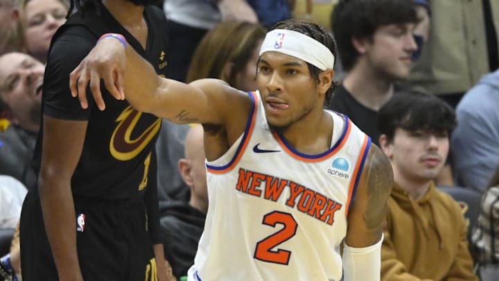 Mar 3, 2024; Cleveland, Ohio, USA; New York Knicks guard Miles McBride (2) celebrates his three-point basket in front of Cleveland Cavaliers guard Darius Garland (10) in the fourth quarter at Rocket Mortgage FieldHouse. Mandatory Credit: David Richard-Imagn Images