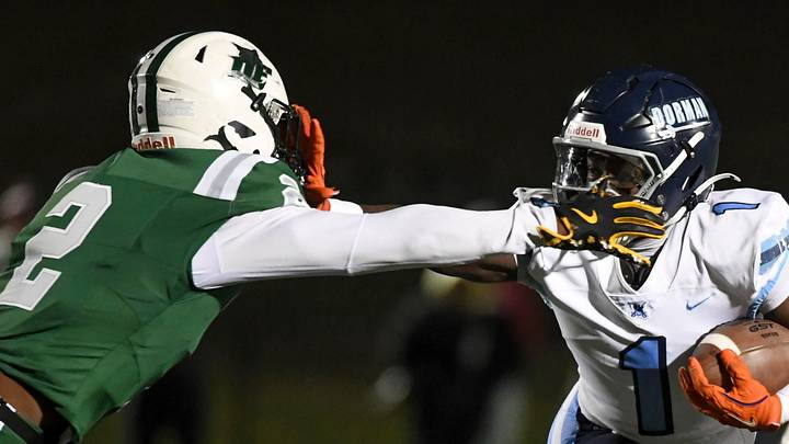 Dorman Cavaliers Nick Means (1) stiff arms Dutch Fork Silver Foxes Mario Anderson (2) Friday, Nov. 28, 2025, during the SCHSL semi state football game at Dutch Fork High School in Irmo, South Carolina. Dorman Cavaliers Nick Means (1) stiff arms Dutch Fork Silver Foxes Mario Anderson (2) Friday, Nov. 28, 2025, during the SCHSL semi state football game at Dutch Fork High School in Irmo, South Carolina.