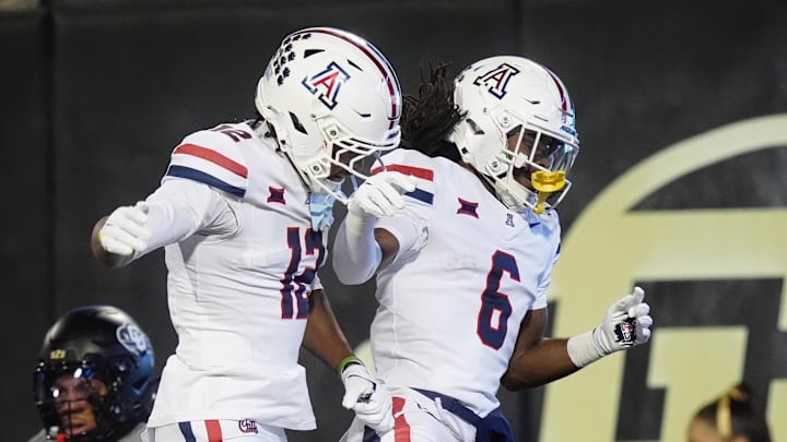 Nov 1, 2025; Boulder, Colorado, USA; Arizona Wildcats wide receiver Javin Whatley (6) celebrates his touchdown with wide receiver Tre Spivey (12) second quarter against the Colorado Buffaloes at Folsom Field. Mandatory Credit: Ron Chenoy-Imagn Images