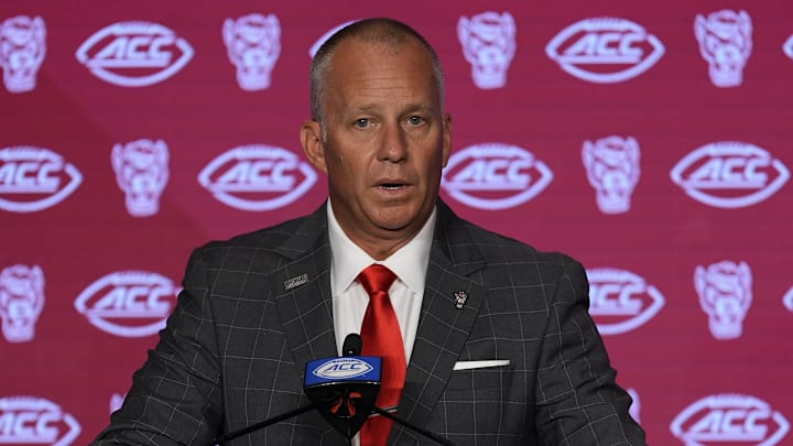 Jul 25, 2024; Charlotte, NC, USA;  North Carolina State Wolfpack head coach Dave Doeren speaks to the media during the ACC Kickoff at Hilton Charlotte Uptown. Mandatory Credit: Jim Dedmon-Imagn Images