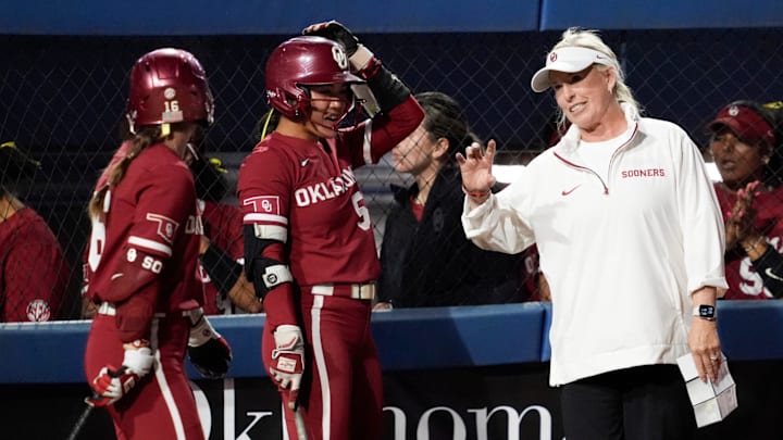 Oklahoma coach Patty Gasso gives instructions to second baseman Ailana Agbayani. Oklahoma coach Patty Gasso gives instructions to second baseman Ailana Agbayani.