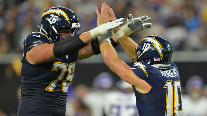 Joe Alt and Justin Herbert celebrate after big play.