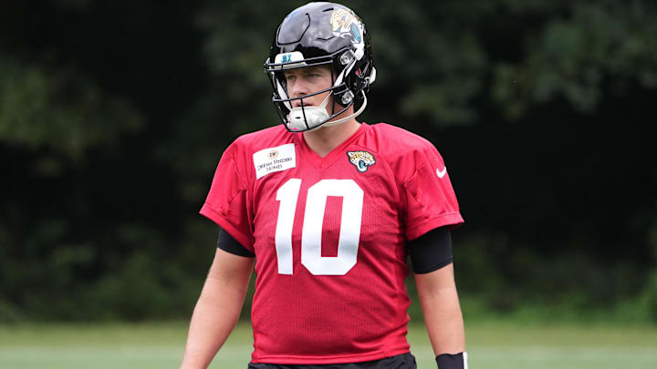 Oct 16, 2024; Watford, United Kingdom; Jacksonville Jaguars quarterback Mac Jones (10) throws the ball during practice at The Grove. Mandatory Credit: Kirby Lee-Imagn Images