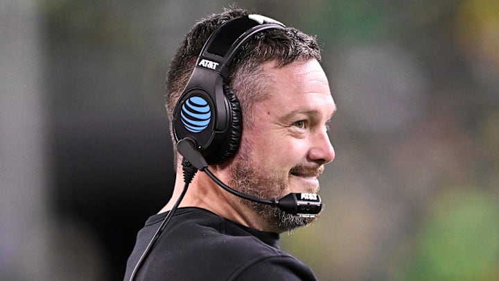 Dec 20, 2025; Eugene, OR, USA;  Oregon Ducks head coach Dan Lanning smiles during the third quarter against the James Madison Dukes at Autzen Stadium. Mandatory Credit: Craig Strobeck-Imagn Images