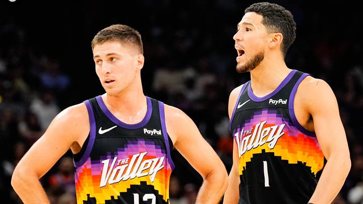 Nov 13, 2025; Phoenix, Arizona, USA; Phoenix Suns guard Collin Gillespie (12) and Phoenix Suns guard Devin Booker (1) during the first half of the game at Mortgage Matchup Center. Mandatory Credit: Arianna Grainey-Imagn Images Nov 13, 2025; Phoenix, Arizona, USA; Phoenix Suns guard Collin Gillespie (12) and Phoenix Suns guard Devin Booker (1) during the first half of the game at Mortgage Matchup Center. Mandatory Credit: Arianna Grainey-Imagn Images