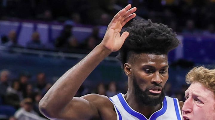 Orlando Magic forward Jonathan Isaac defends Brooklyn Nets forward Danny Wolf.