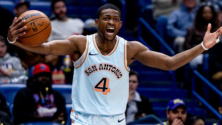 Feb 23, 2025; New Orleans, Louisiana, USA;  San Antonio Spurs guard De'Aaron Fox (4) reacts  to a play against the New Orleans Pelicans during the second half at Smoothie King Center. Mandatory Credit: Stephen Lew-Imagn Images
