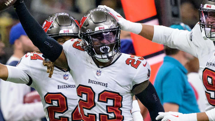 Oct 13, 2024; New Orleans, Louisiana, USA; Tampa Bay Buccaneers safety Tykee Smith (23) celebrates an interception of a ball intended for New Orleans Saints wide receiver Rashid Shaheed (22) with cornerback Tyrek Funderburk (24) and linebacker Joe Tryon-Shoyinka (9) during the fourth quarter at Caesars Superdome. Mandatory Credit: Matthew Hinton-Imagn Images Oct 13, 2024; New Orleans, Louisiana, USA; Tampa Bay Buccaneers safety Tykee Smith (23) celebrates an interception of a ball intended for New Orleans Saints wide receiver Rashid Shaheed (22) with cornerback Tyrek Funderburk (24) and linebacker Joe Tryon-Shoyinka (9) during the fourth quarter at Caesars Superdome. Mandatory Credit: Matthew Hinton-Imagn Images