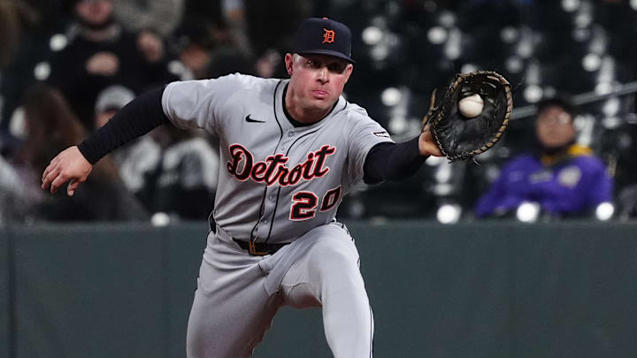 May 7, 2025; Denver, Colorado, USA; Detroit Tigers first base Spencer Torkelson (20) fields the ball in the tenth inning against the Colorado Rockies at Coors Field. 
