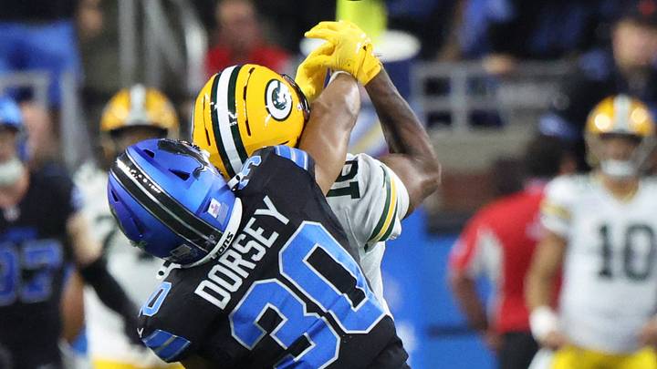 Detroit Lions cornerback Khalil Dorsey (30) reaches for the ball against Green Bay Packers wide receiver at Ford Field Detroit Lions cornerback Khalil Dorsey (30) reaches for the ball against Green Bay Packers wide receiver at Ford Field
