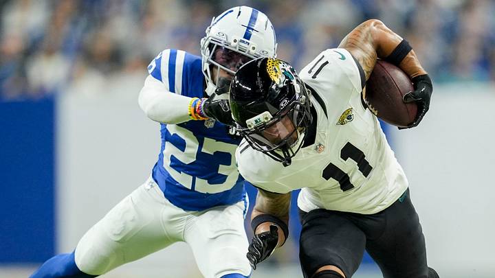 Former Colts cornerback Kenny Moore II (23) shoves Jacksonville Jaguars wide receiver Parker Washington (11) Former Colts cornerback Kenny Moore II (23) shoves Jacksonville Jaguars wide receiver Parker Washington (11)
