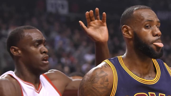 Cleveland Cavaliers forward LeBron James controls the ball as Toronto Raptors forward Pascal Siakam defends.