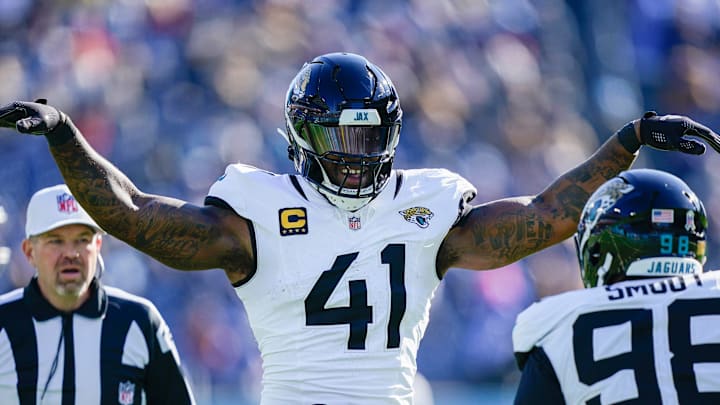 Jacksonville Jaguars defensive end Dawuane Smoot (98) and defensive end Josh Hines-Allen (41) celebrate sacking Tennessee Titans quarterback Cam Ward (1) during the second quarter at Nissan Stadium in Nashville, Tenn., Sunday, Nov. 30, 2025.