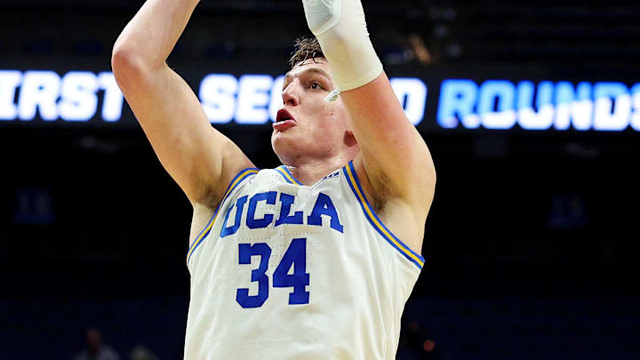 Mar 20, 2025; Lexington, KY, USA;  UCLA Bruins forward Tyler Bilodeau (34) shoots the ball against Utah State Aggies guard Mason Falslev (12) during the second half in the first round of the NCAA Tournament at Rupp Arena. Mandatory Credit: Jordan Prather-Imagn Images