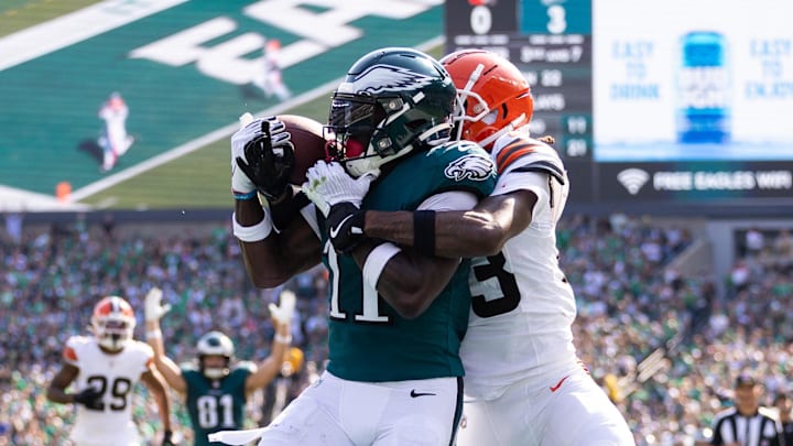 Oct 13, 2024; Philadelphia, Pennsylvania, USA; Philadelphia Eagles wide receiver A.J. Brown (11) makes a touchdown catch against Cleveland Browns cornerback Martin Emerson Jr. (23) during the second quarter at Lincoln Financial Field. Mandatory Credit: Bill Streicher-Imagn Images