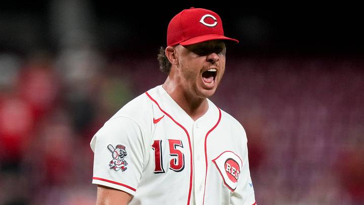 Cincinnati Reds pitcher Emilio Pagán (15) cheers