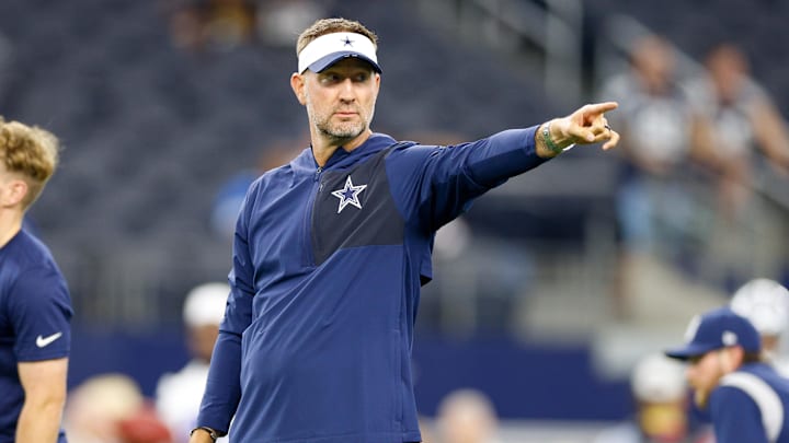 Dallas Cowboys head coach Brian Schottenheimer gives directions before a game against the Atlanta Falcons at AT&T Stadium. 