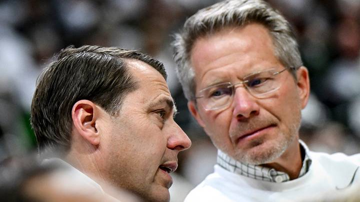 Michigan State Athletic Director J Batt, left, talks with MSU President Kevin Guskiewicz during the Spartans men's basketball game against Arkansas on Saturday, Nov. 8, 2025, at the Breslin Center in East Lansing. Michigan State Athletic Director J Batt, left, talks with MSU President Kevin Guskiewicz during the Spartans men's basketball game against Arkansas on Saturday, Nov. 8, 2025, at the Breslin Center in East Lansing.