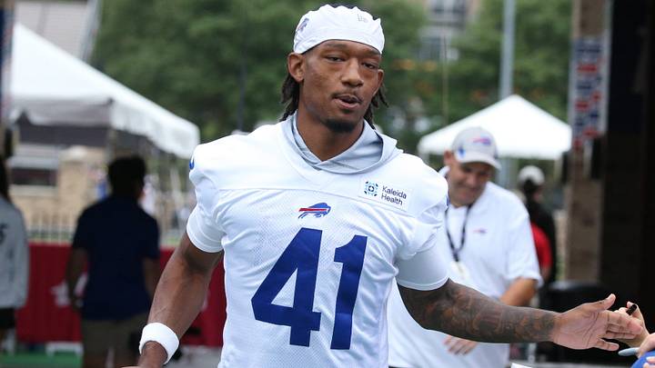Bills defensive back Kani Walker high-fives fans as the takes the field during day two of Buffalo Bills training camp. Bills defensive back Kani Walker high-fives fans as the takes the field during day two of Buffalo Bills training camp.