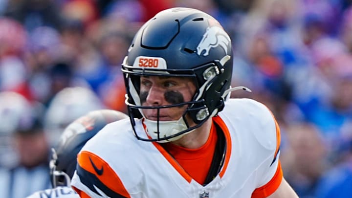 Denver Broncos quarterback Bo Nix (10) turns to look for an open receiver during the first half of the Buffalo Bills wild card game against the Denver Broncos at Highmark Stadium in Orchard Park on Jan. 12, 2025.