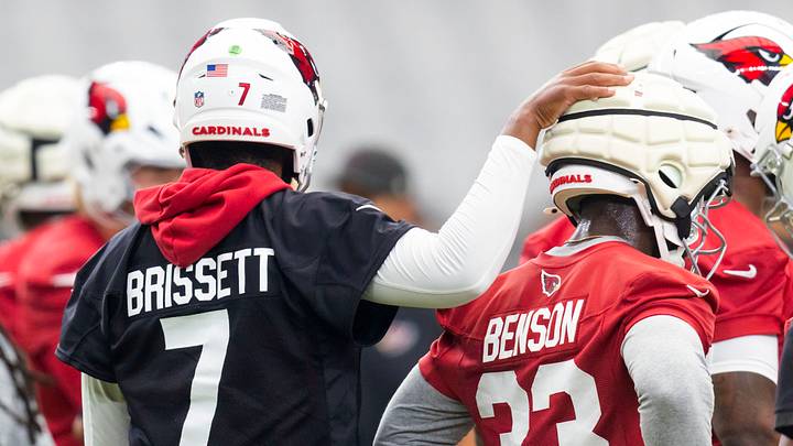 Jul 23, 2026; Glendale, AZ, USA; Arizona Cardinals quarterback Jacoby Brissett (7) with running back Trey Benson (33) during training camp at State Farm Stadium. Mandatory Credit: Mark J. Rebilas-Imagn Images Jul 23, 2026; Glendale, AZ, USA; Arizona Cardinals quarterback Jacoby Brissett (7) with running back Trey Benson (33) during training camp at State Farm Stadium. Mandatory Credit: Mark J. Rebilas-Imagn Images