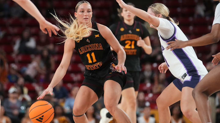 ASU Sun Devils guard Marley Washenitz (11) brings the ball up court as Kansas State Wildcats guard Taryn Sides (11) defends at Desert Financial Arena in Tempe on Feb. 1, 2026.