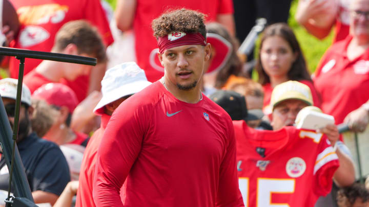 Jul 22, 2024; St. Joseph, MO, USA; Kansas City Chiefs quarterback Patrick Mahomes (15) signs autographs for fans after training camp at Missouri Western State University. Mandatory Credit: Denny Medley-USA TODAY Sports Jul 22, 2024; St. Joseph, MO, USA; Kansas City Chiefs quarterback Patrick Mahomes (15) signs autographs for fans after training camp at Missouri Western State University. Mandatory Credit: Denny Medley-USA TODAY Sports