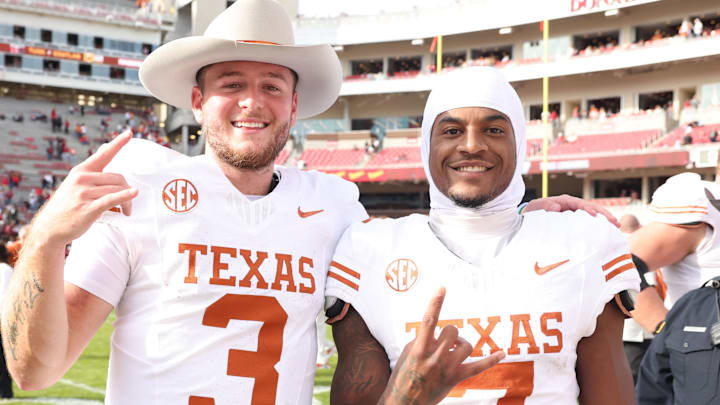 Texas Longhorns quarterback Quinn Ewers (3) and wide receiver Isaiah Bond (7) celebrate after beating Arkansas 20-10 at Razorback Stadium on Nov. 16, 2024.