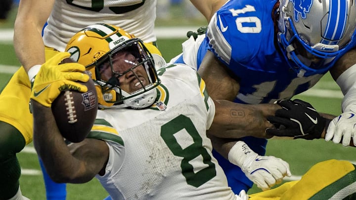 Green Bay Packers running back Josh Jacobs (8) scores a touchdown against the Detroit Lions last season.